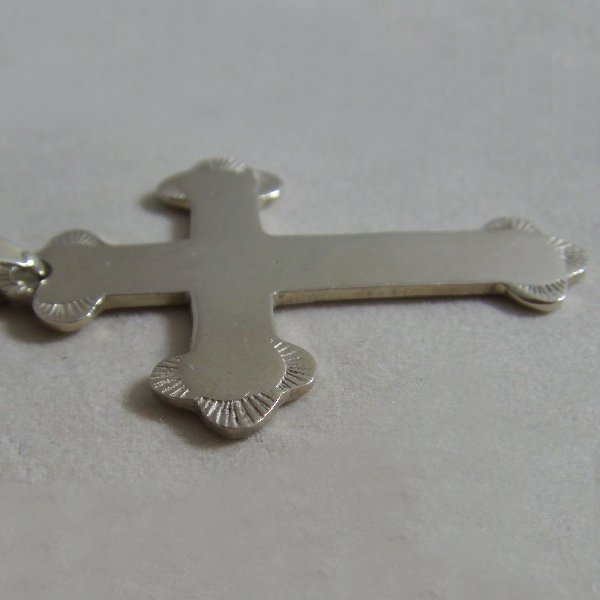 (p1066)Silver cross with rounded tips.